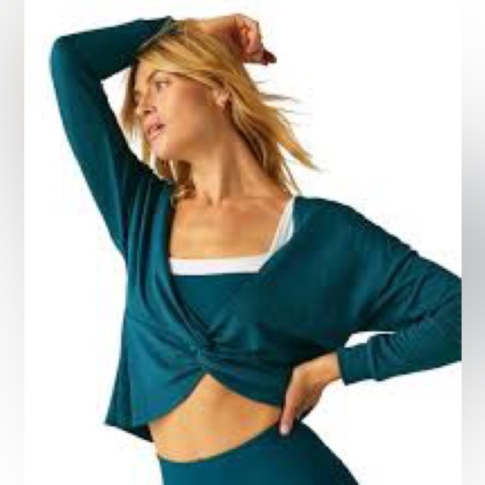 Teal long-sleeve crop top with a front twist detail. - Picture 1 of 4